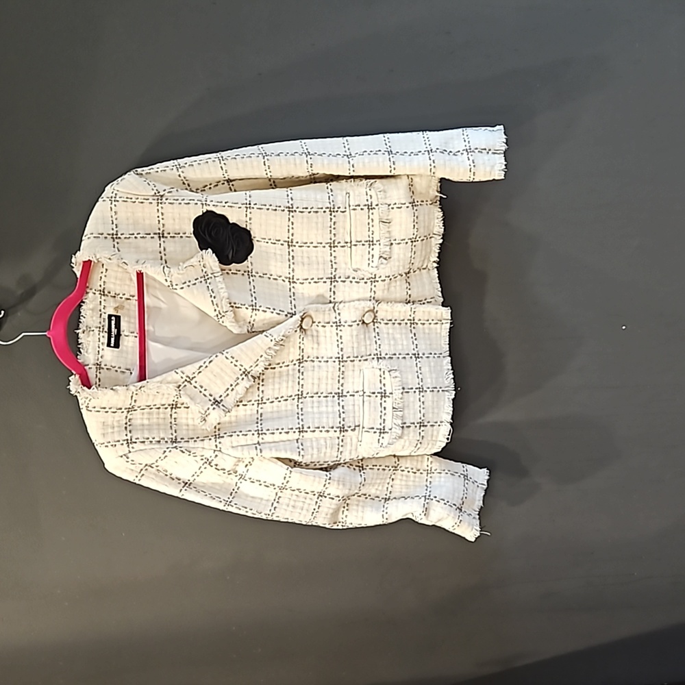 Karl Lagerfeld spring blazer with short fringe along sleeve and blazer edges.